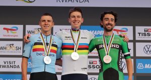 Tadej Pogačar, Remco Evenepoel and Ben Healey on the podium of the Men Elite Road Race in Kigali.