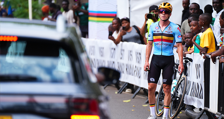 Remco Evenepoel on the side of the road waiting for a new bike during the Men Elite Road Race in Kigali.