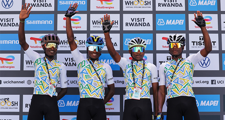 Niyonkuru Samuel, Tuyizere Etienne, Ufitimana Shadrack, and Ruhumuriza Aime greet the Rwandan crowd before the start of the Men Under 23 Road Race in Kigali